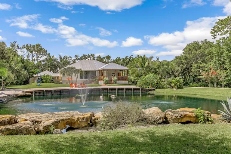 Oakes Estates Home Exterior With Pond, Naples Florida
