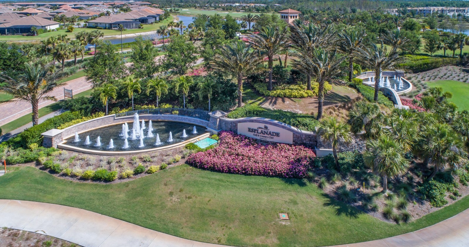 Aerial view of Esplanade Golf & Country Club's clubhouse and 18-hole championship course in North Naples, FL