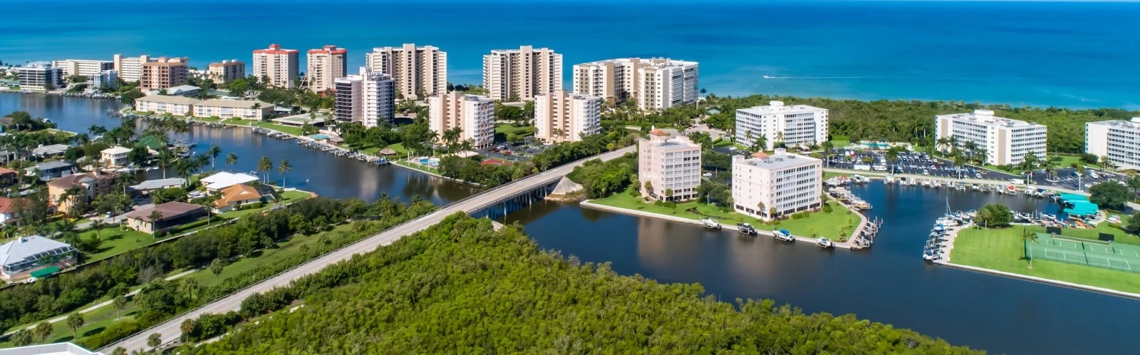 Aerial view of the waterway and towers near The Dunes of Naples, North Naples Florida