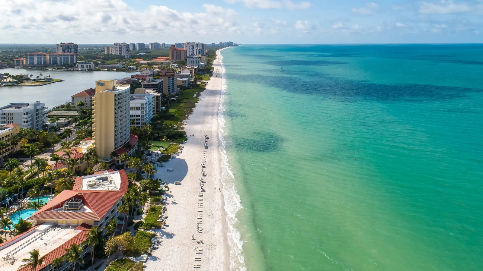 Aerial view of the Vanderbilt Beach and LaPlaya corridor in North Naples, Gulf-front luxury hotel and real estate zone