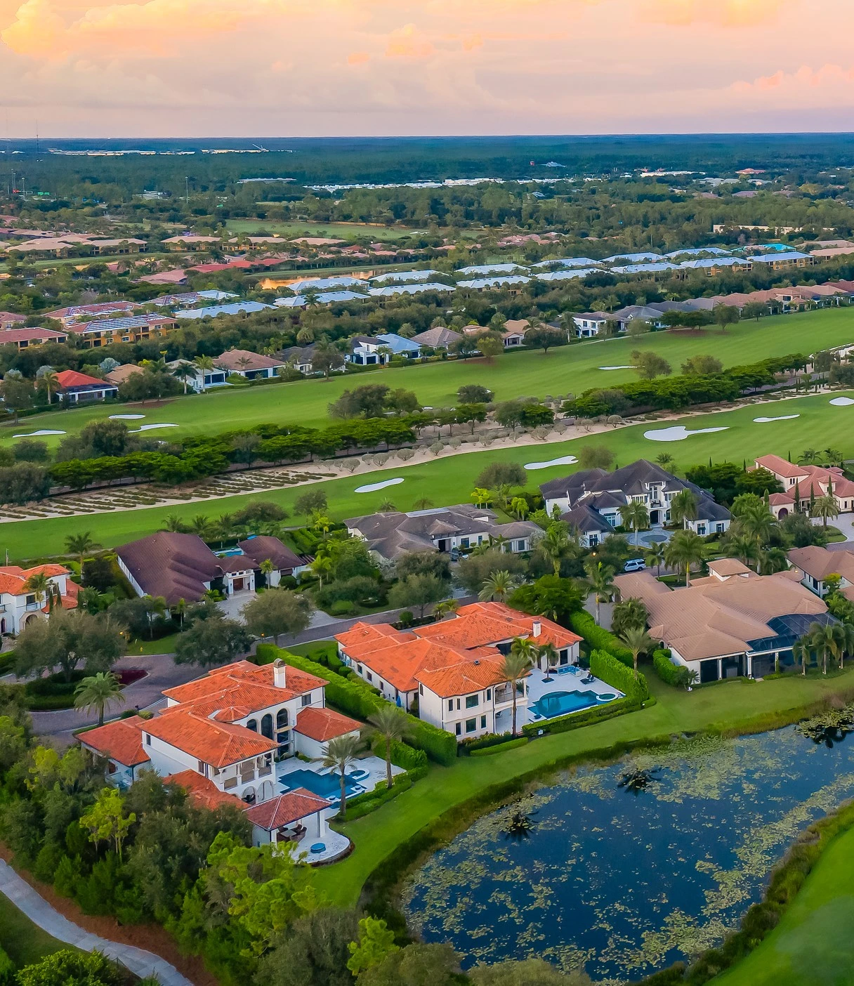 Aerial view of Talis Park homes along the golf course in Naples, Florida