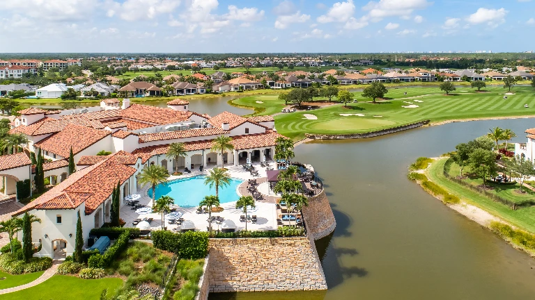 Vyne House clubhouse pool overlooking the golf course at Talis Park in Naples, Florida